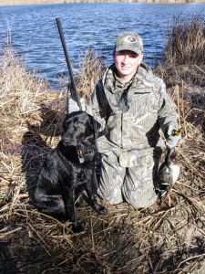 Lucas Brockman with Ozzie duck hunt